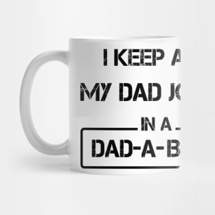 i keep all my dad jokes in a dad a base Mug